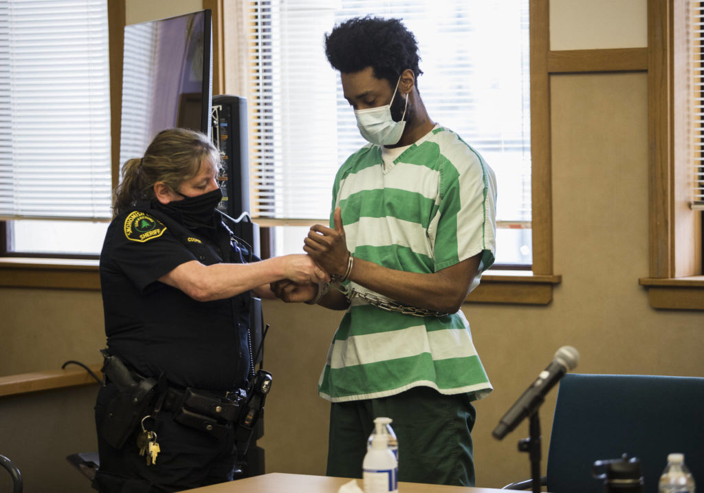 Kevin Lewis is handcuffed after receiving a life sentence Tuesday for aggravated first-degree murder. (Olivia Vanni / The Herald)
