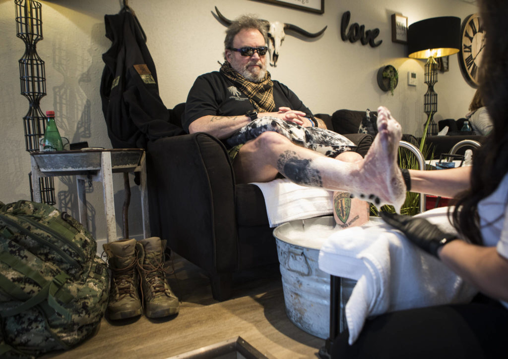 Keith Reyes, 64, gets his monthly pedicure at Nail Flare in Stanwood. The Purple Heart recipient has nerve damage in his feet from blast injuries. (Olivia Vanni / The Herald)
