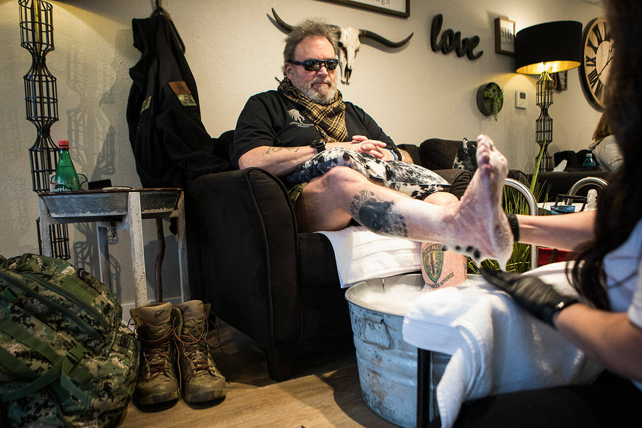 Veteran Keith F. Reyes, 64, gets his monthly pedicure at Nail Flare on Tuesday, Dec. 21, 2021 in Stanwood, Wa. (Olivia Vanni / The Herald)
