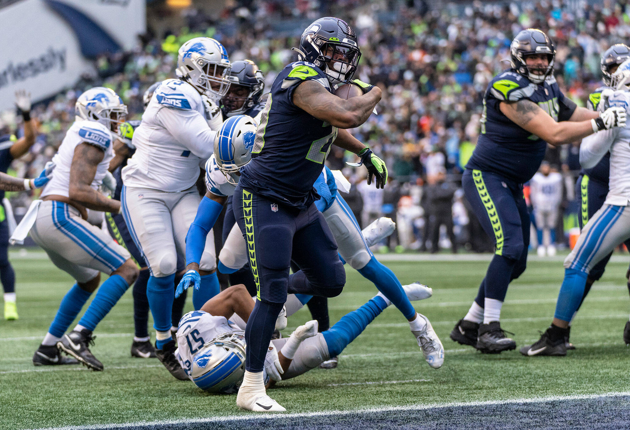 Seattle Seahawks running back Rashaad Penny scores a touchdown during the first half of a game Sunday in Seattle. (AP Photo/Stephen Brashear)