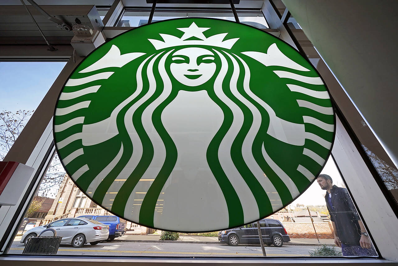 Starbucks says its U.S. workers must be fully vaccinated by Feb. 9 or face a weekly COVID testing requirement. (AP Photo/Gene J. Puskar, file)