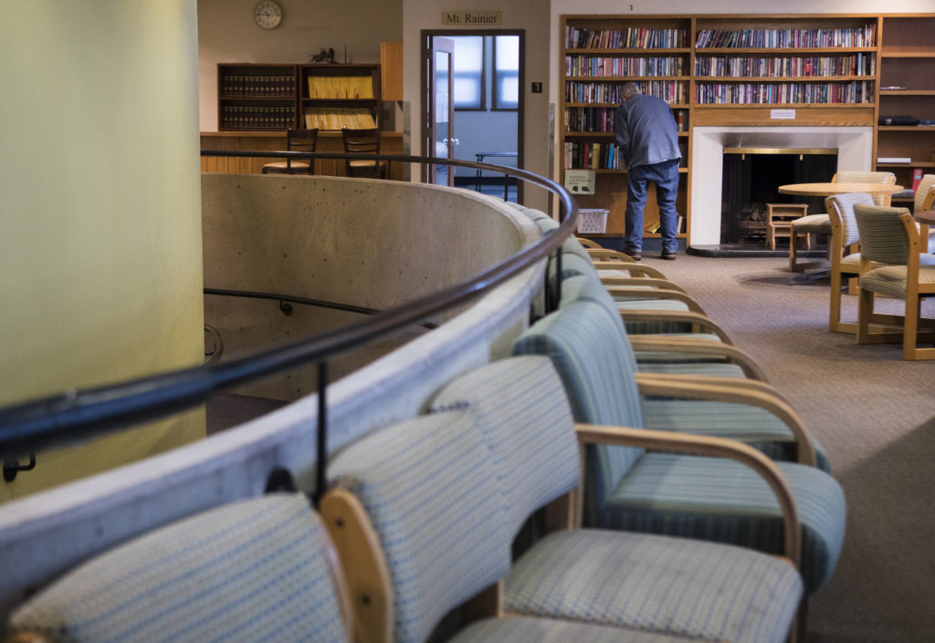 People browse books available at the Carl Gipson Center on Wednesday. (Olivia Vanni / The Herald)
