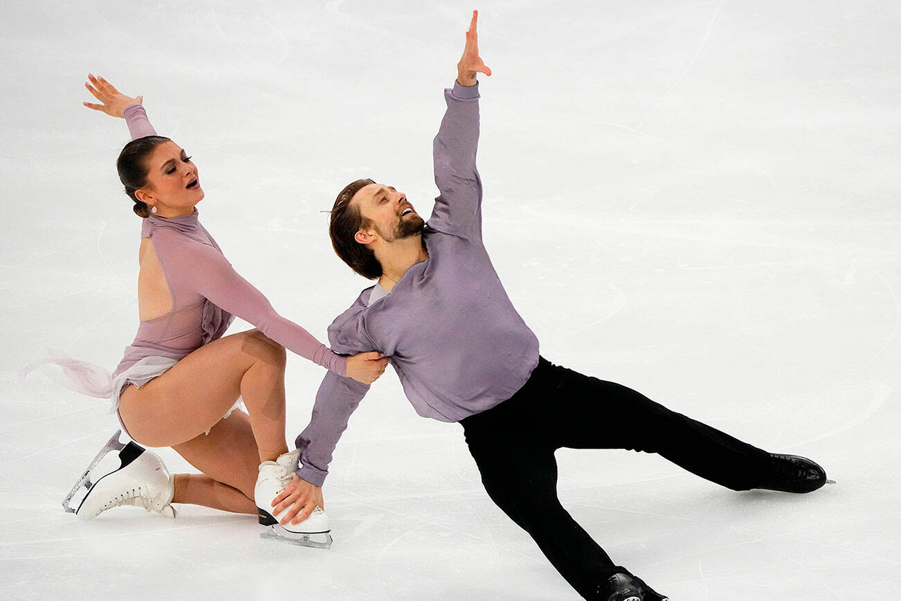 Kaitlin Hawayek and Jean-Luc Baker of USA perform in the ice dance free dance skating program during the ISU Grand Prix of Figure Skating Rostelecom Cup in Sochi, Russia, Saturday, Nov. 27, 2021. (AP Photo/Alexander Zemlianichenko)
