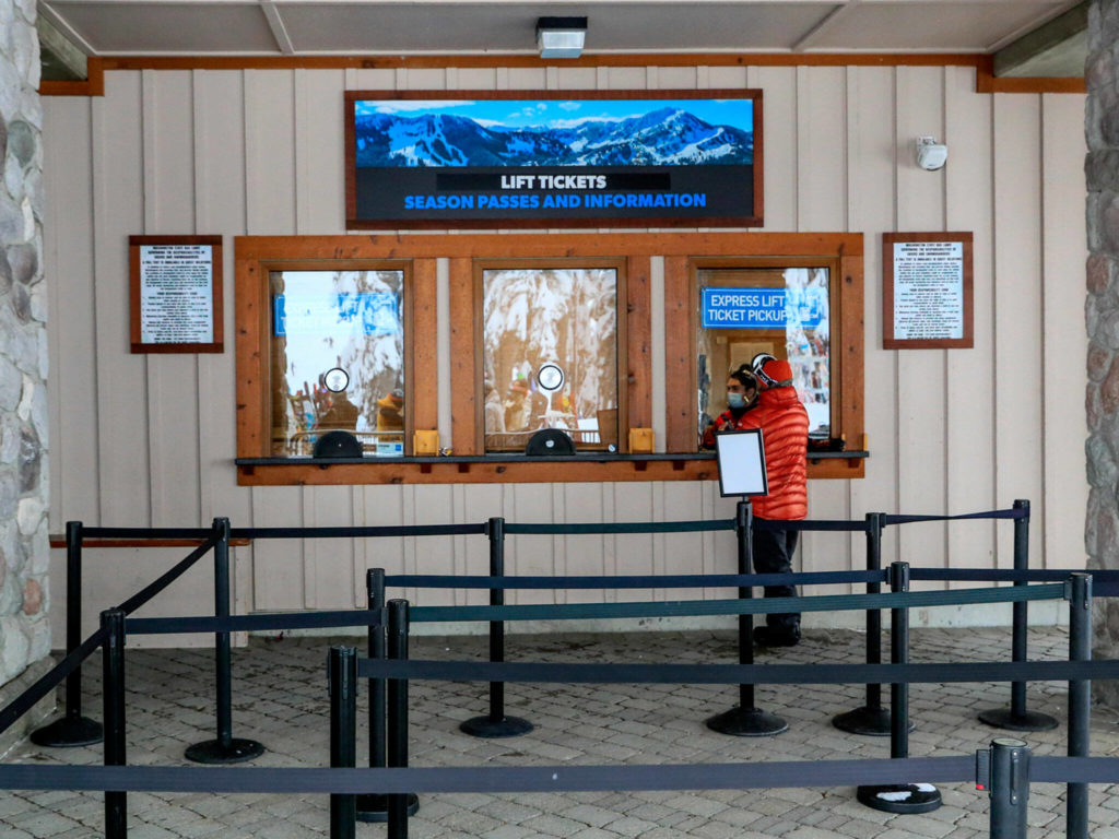 A customer talks with counter representative at Stevens Pass on Dec. 30. (Kevin Clark / The Herald)
