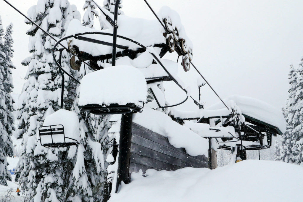 A chair lift sits idle on Stevens Pass on Dec. 30. (Kevin Clark / The Herald)
