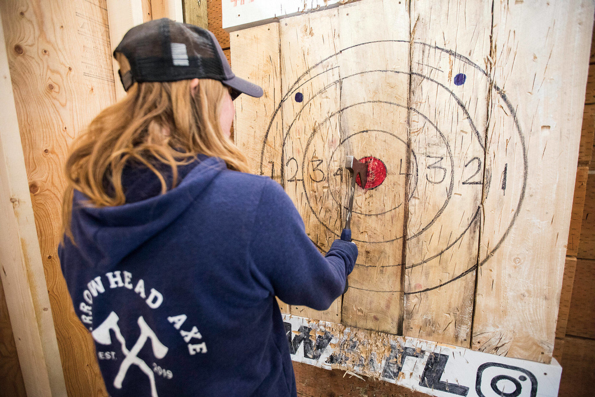 Axe throwing hitting a bull’seye in Everett and Camano Island