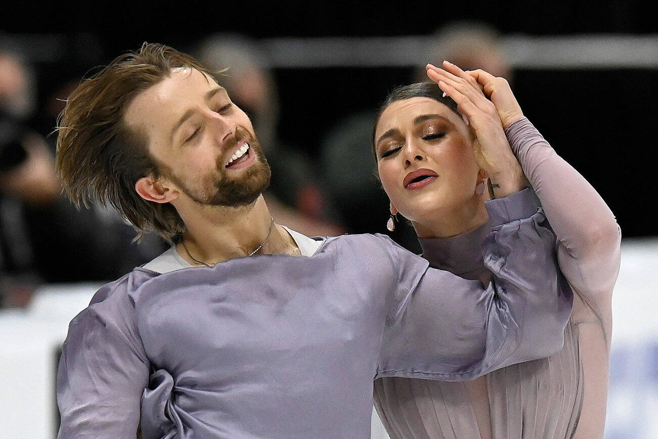 Kaitlin Hawayek and Jean-Luc Baker compete in the ice dance program during the U.S. Figure Skating Championships Saturday, Jan. 8, 2022, in Nashville, Tenn. (AP Photo/Mark Zaleski)