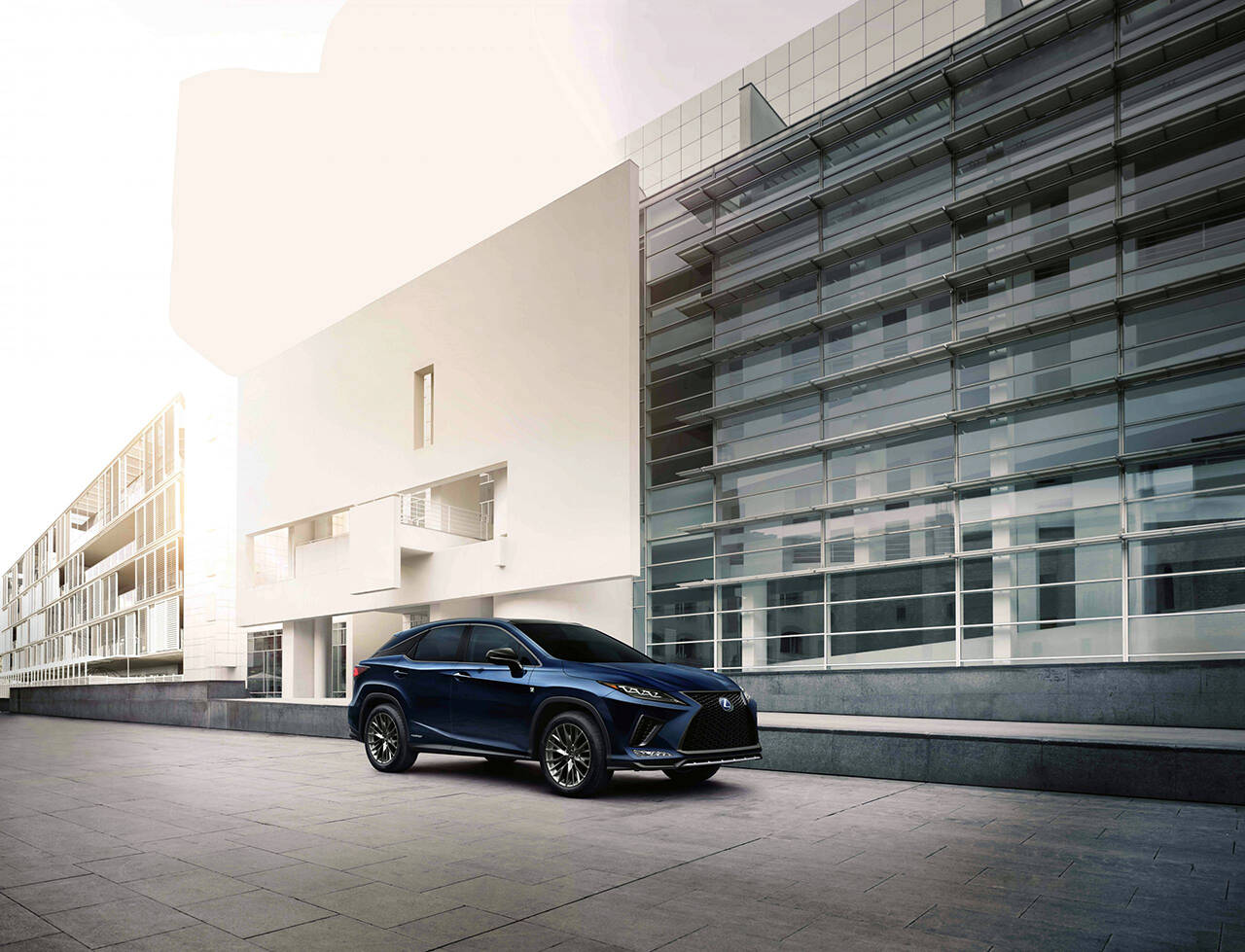 The 2022 Lexus RX 450h is a premium mid-size hybrid SUV. The model shown here has an optional F Sport appearance package that includes 20-inch wheels. (Manufacturer photo)