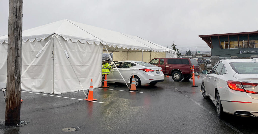 The line was short at the Snohomish Health District’s appointment-only COVID-19 testing site in the parking lot of Everett’s Longfellow building on Friday, but on Monday there were no appointments available. (Sue Misao / The Herald)
