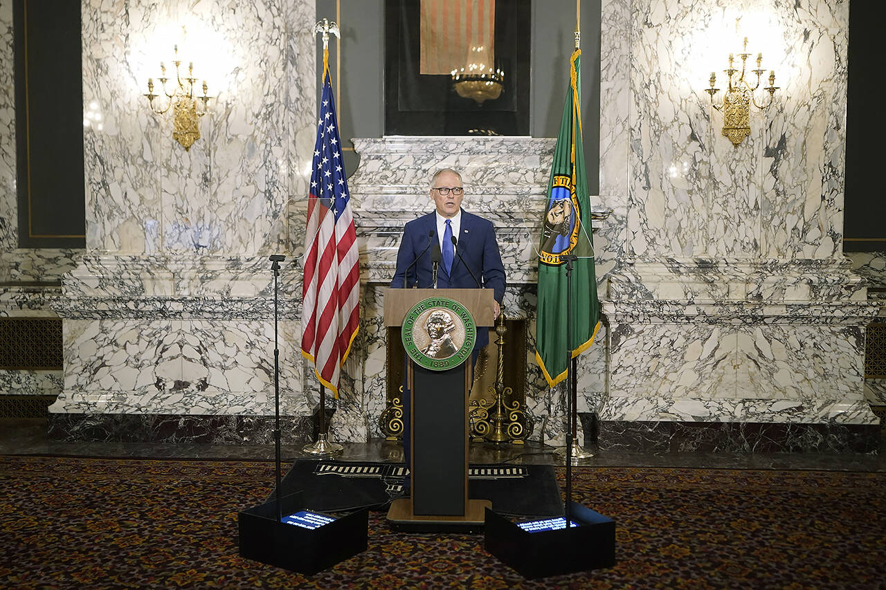 Washington Gov. Jay Inslee gives his annual State of the State address Tuesday at the Capitol in Olympia. (AP Photo/Ted S. Warren)