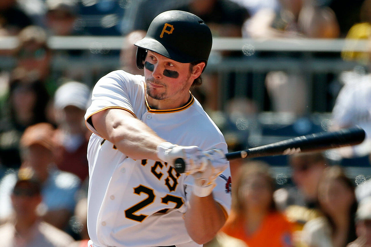 FILE - In this Sept. 15, 2015, file photo, Pittsburgh Pirates' Travis Snider drives in two runs with a single off Chicago Cubs starting pitcher Jason Hammel during the first inning of the first baseball game of a doubleheader in Pittsburgh. Snider has agreed to a minor league contract with the Texas Rangers and will attend big league spring training. Snider, whose deal was announced Friday, Jan. 6, 2017, did not appear in the major leagues last season. (AP Photo/Gene J. Puskar, File)