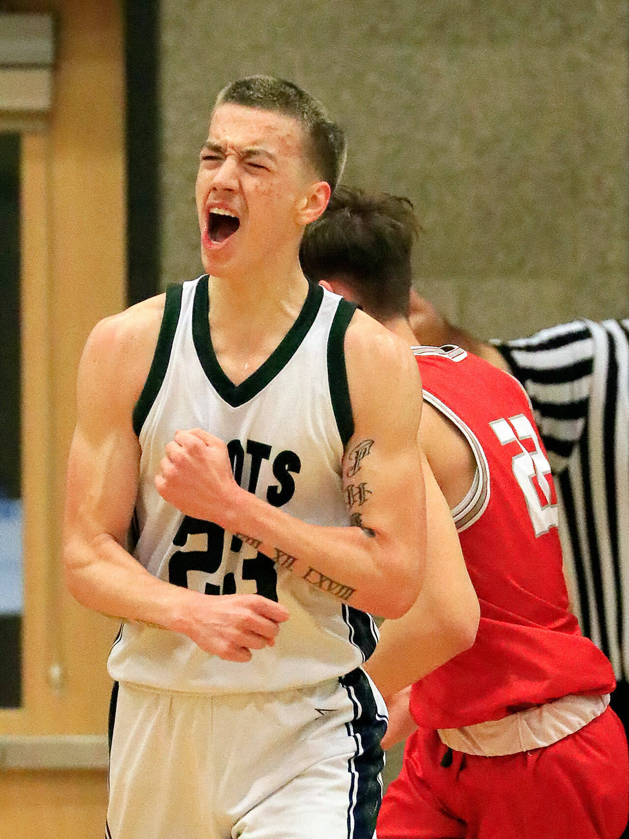 Parker Baumann celebrates one of his baskets. (Kevin Clark / The Herald)
