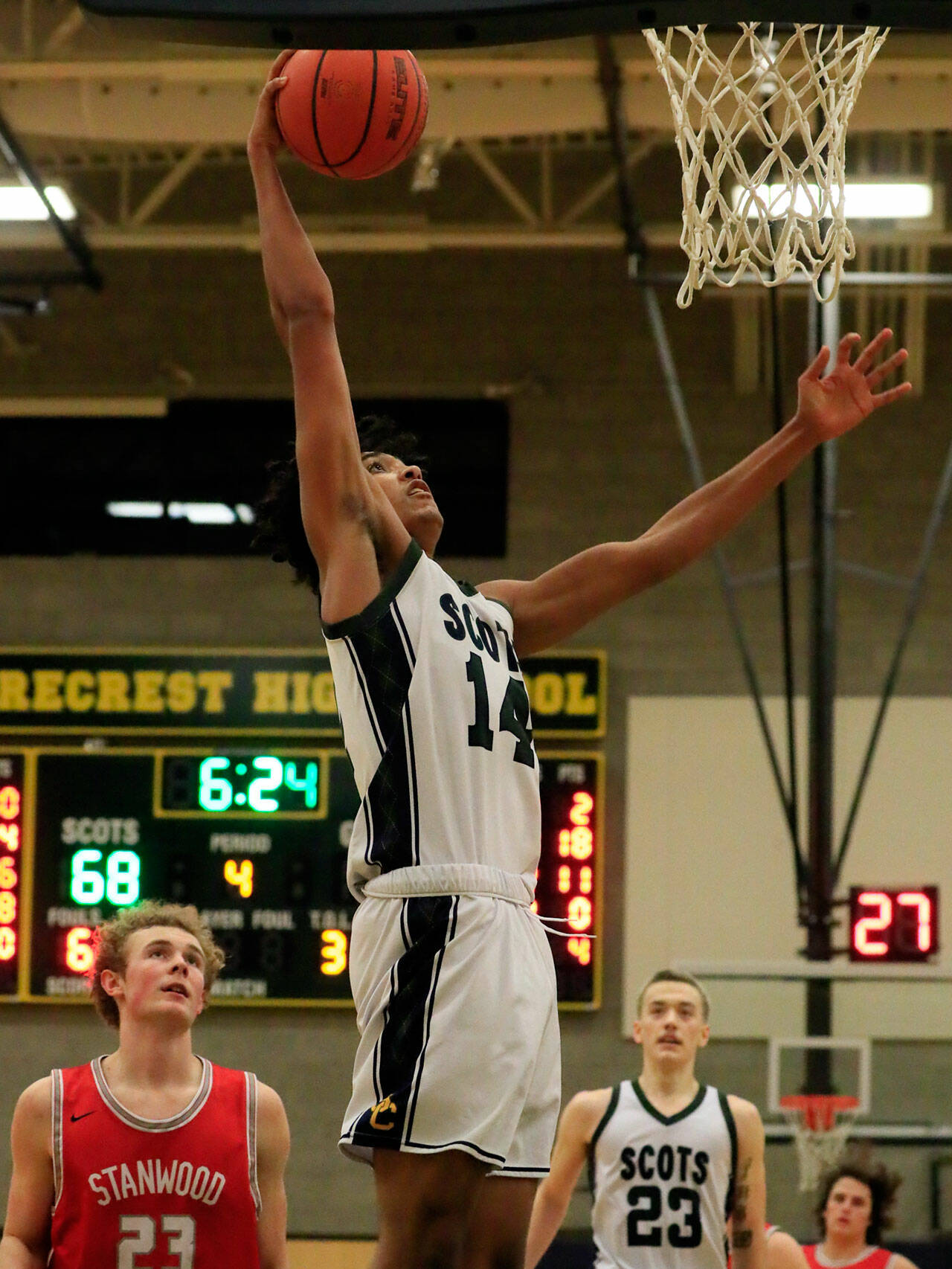 Devon Nehring slams home one of his three dunks during a 24-point performance in Shorecrest’s 88-68 win over Stanwood on Thursday night. (Kevin Clark / The Herald)