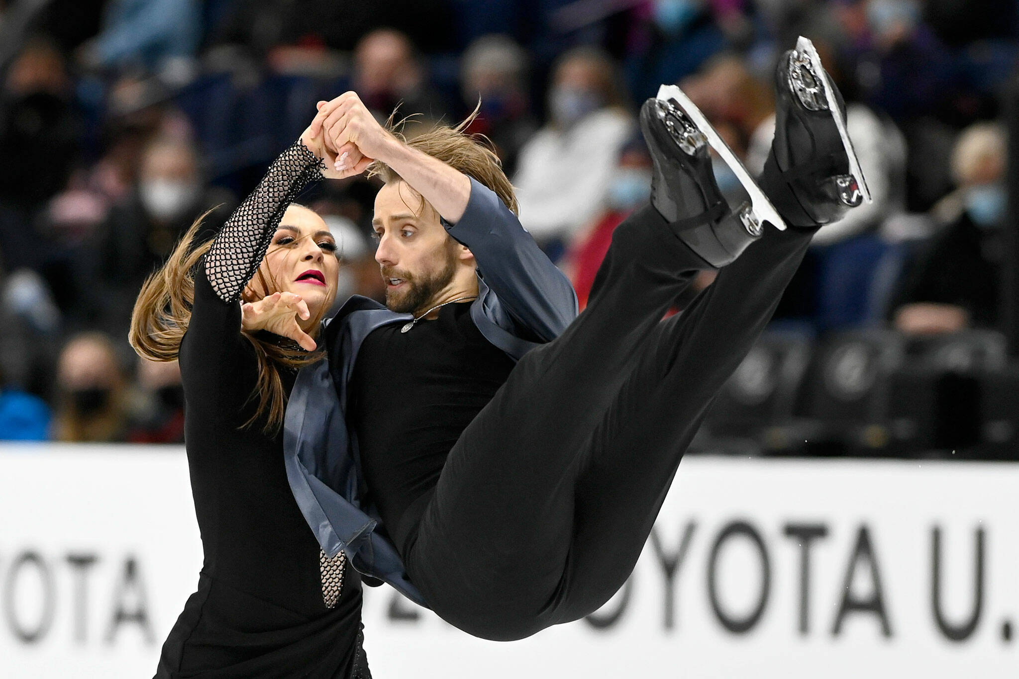 Kaitlin Hawayek and Jean-Luc Baker compete in the rhythm dance program during the U.S. Figure Skating Championships on Jan. 7, 2022, in Nashville, Tenn. (AP Photo/Mark Zaleski)