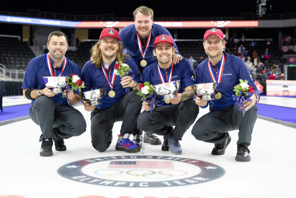 Sean Beighton (middle) and Team Shuster members pose with their gold medals during the U.S. Olympic Curling Team Trials on Nov. 21, 2021, at Baxter Arena in Omaha, Neb. (AP Photo/Rebecca S. Gratz, File)
