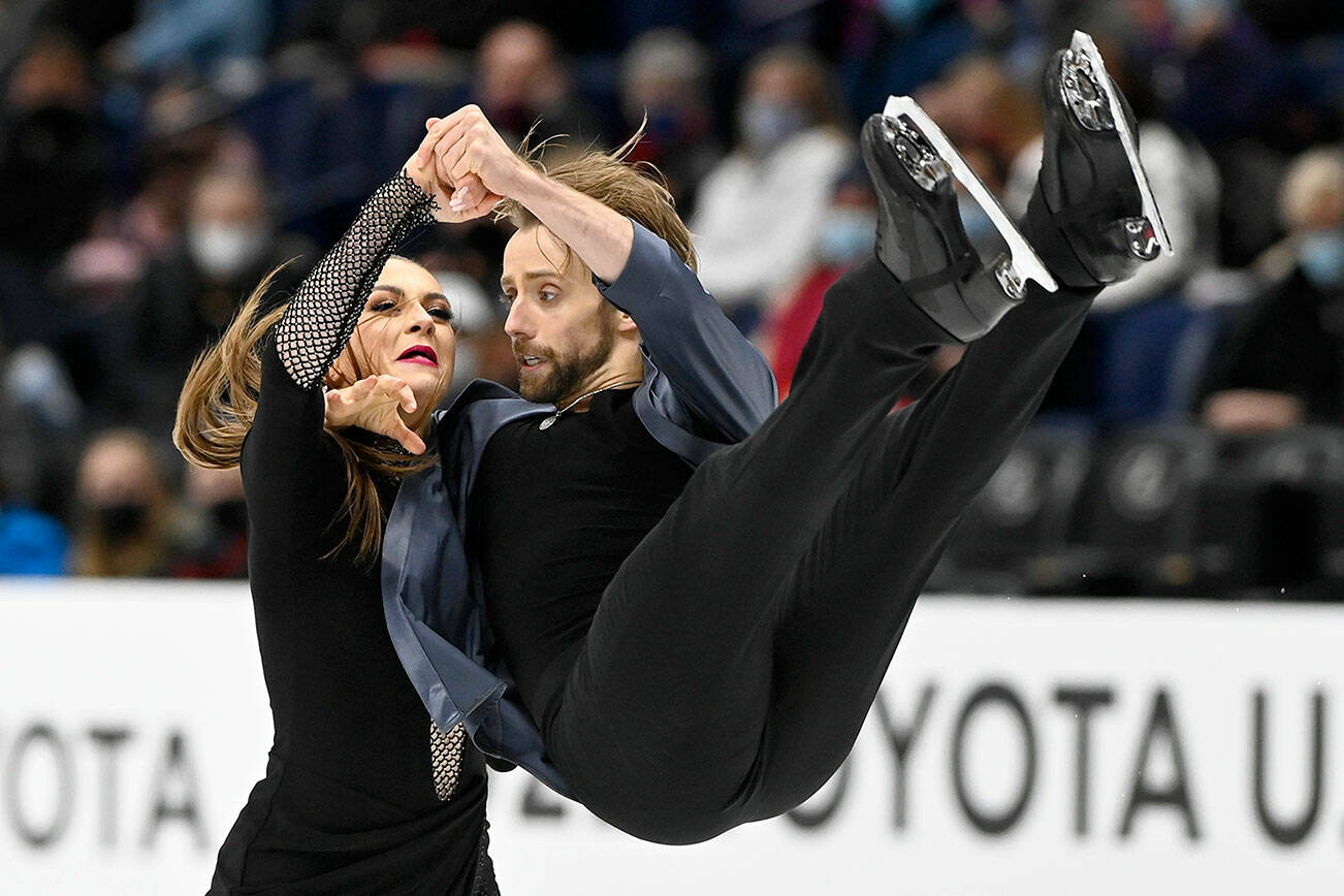 Kaitlin Hawayek and Jean-Luc Baker compete in the rhythm dance program during the U.S. Figure Skating Championships Friday, Jan. 7, 2022, in Nashville, Tenn. (AP Photo/Mark Zaleski)