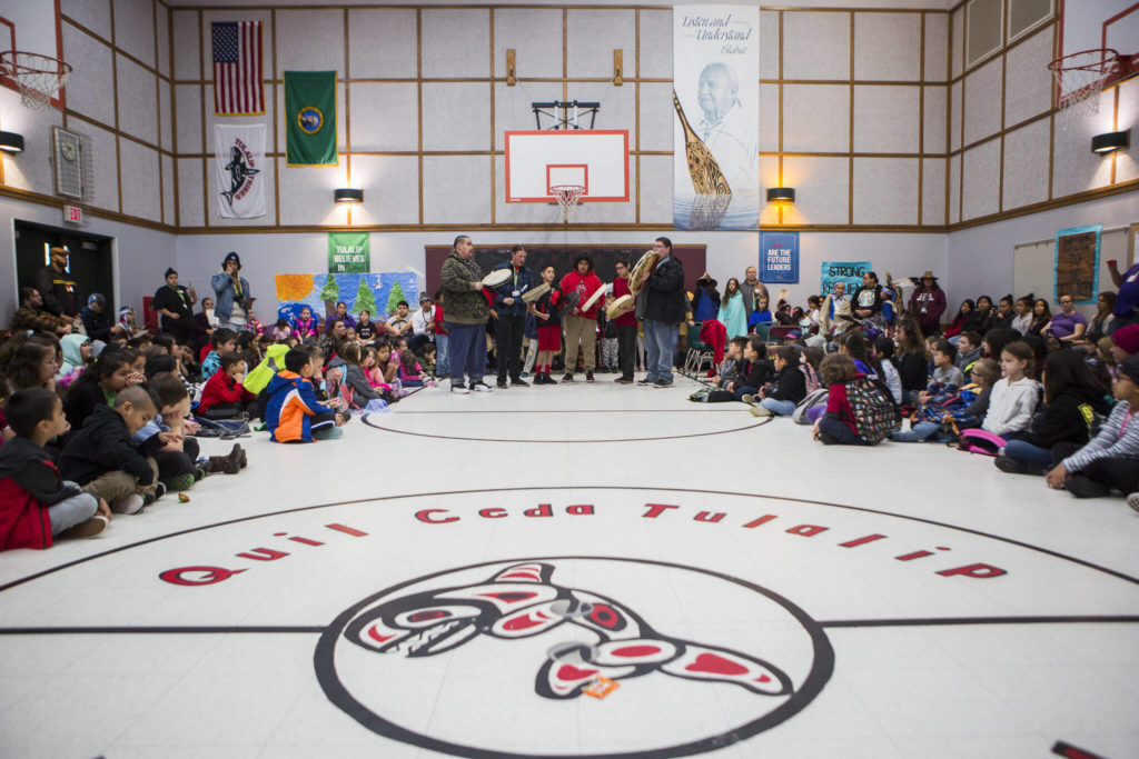 Guest drummers perform at an assembly during Tulalip Day at Quil Ceda Tulalip Elementary on Nov. 27, 2019. (Olivia Vanni / Herald file)
