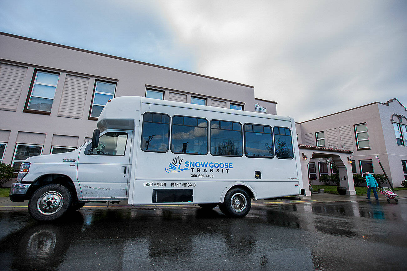The Snow Goose Transit bus at one of it's stops outside of the Lincoln Hill Retirement Community on Thursday, Jan. 20, 2022 in Stanwood, Washington. (Olivia Vanni / The Herald)