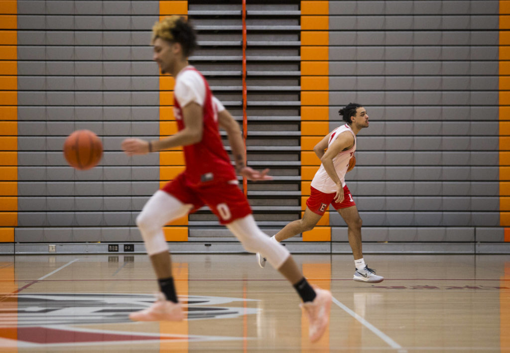 Leon Sayers and Raefe McEnroe warm up during practice Monday in Everett. (Olivia Vanni / The Herald)
