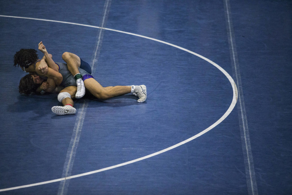 Lake Stevens’ Jackson Balmer and Glacier Peak’s Spencer Dhont wrestle on Tuesday in Snohomish. (Olivia Vanni / The Herald)
