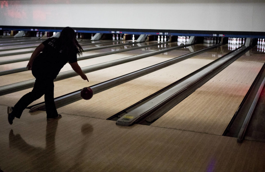 Everett’s Briana Barbour bowls during a match against Jackson on Wednesday in Lynnwood. (Olivia Vanni / The Herald)
