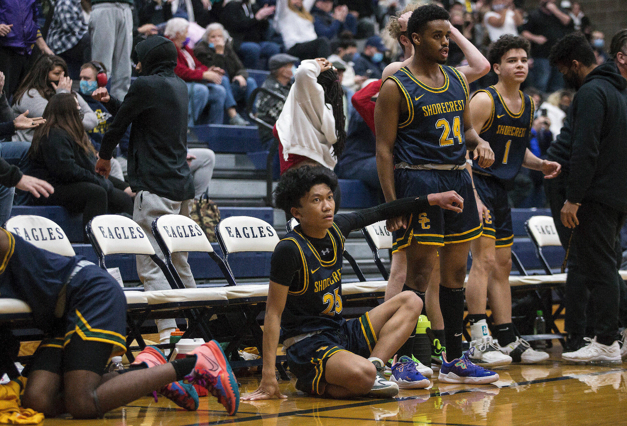 The Shorecrest bench reacts to a missed shot in the final seconds of regular time to send the game against Arlington to overtime on Dec. 14, 2021 in Arlington. (Olivia Vanni / The Herald)