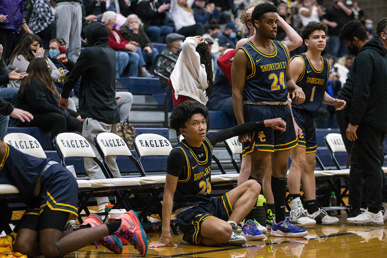 The Shorecrest bench reacts to a missed shot in the final seconds of regular time to send the game against Arlington to overtime on Tuesday, Dec. 14, 2021 in Arlington, Wa. (Olivia Vanni / The Herald)