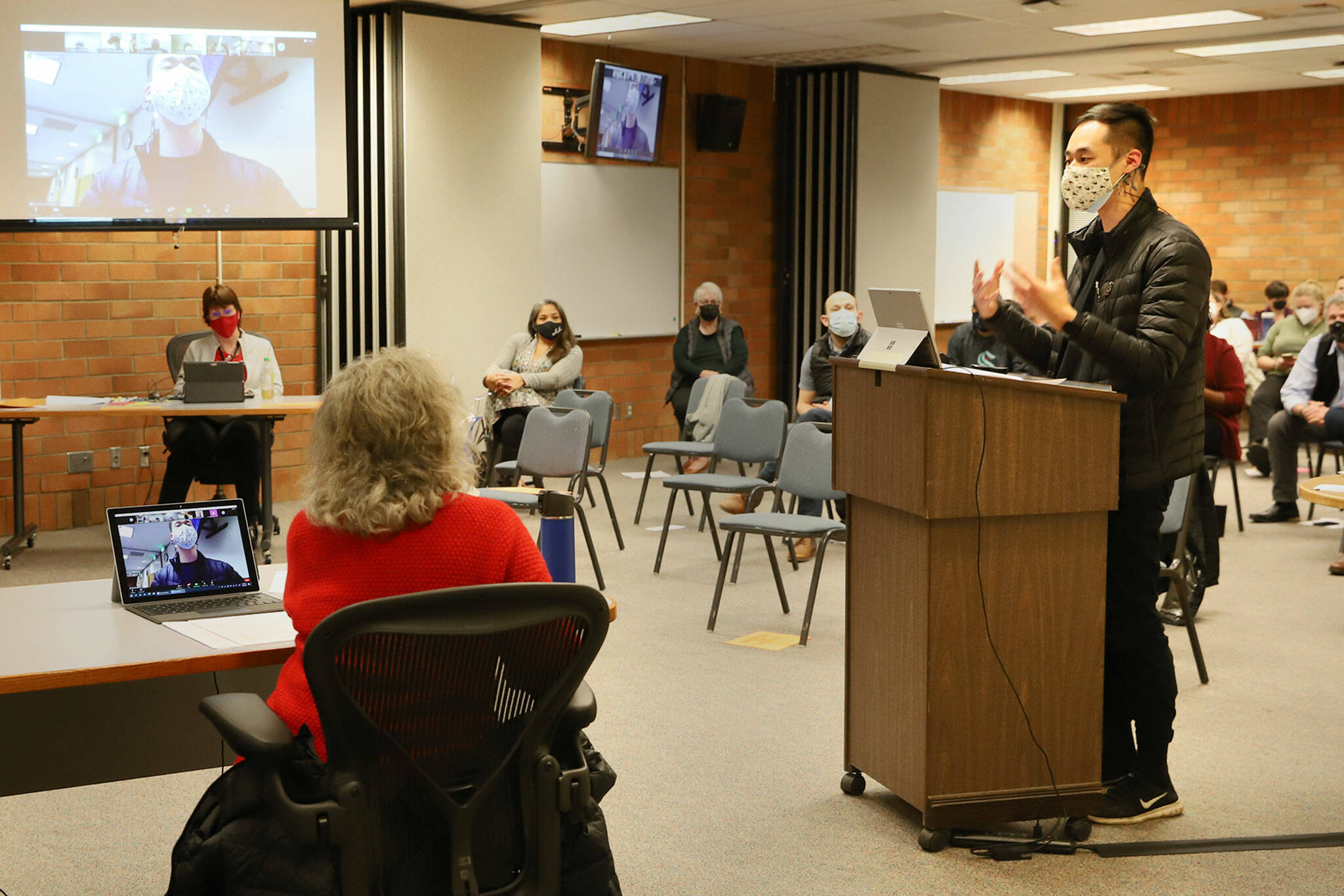 Justin Kang addresses the Mukilteo School Board Monday evening. Kang, and other teachers of the school district, urged the board to no longer require “To Kill A Mockingbird” for ninth-graders. (Kevin Clark / The Herald)