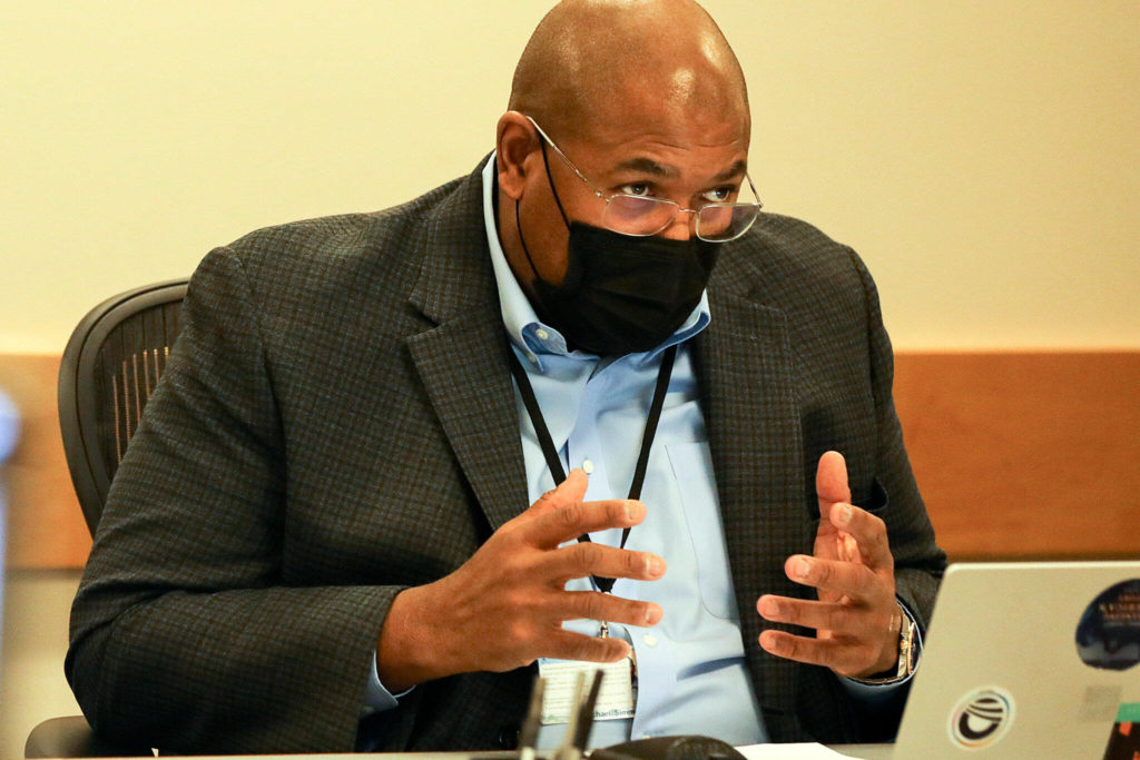 Michael Simmons, president of the Mukilteo School Board, discusses “To Kill A Mockingbird” Monday evening. (Kevin Clark / The Herald)
