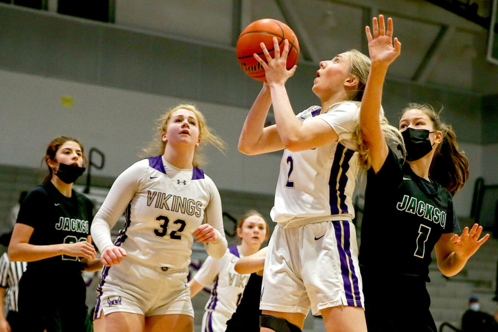 Lake Stevens’ Chloe Pattison attempts a shot with Jackson’s Paige Swander trailing and Jackson’s Arielle Leavens (far left) and Lake Stevens’ Cori Wilcox looking on Saturday evening at Lake Stevens High School. (Kevin Clark / The Herald)
