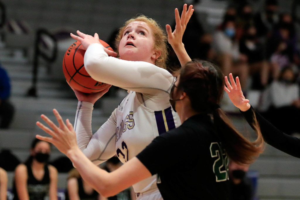 Lake Stevens’ Cori Wilcox looks to shoot with Jackson’s Arielle Leavens defending Saturday evening at Lake Stevens High School. (Kevin Clark / The Herald)
