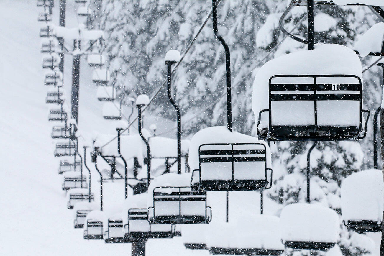 A chair lift sits idle on Stevens Pass Thursday afternoon on December 30, 2021.  (Kevin Clark / The Herald)