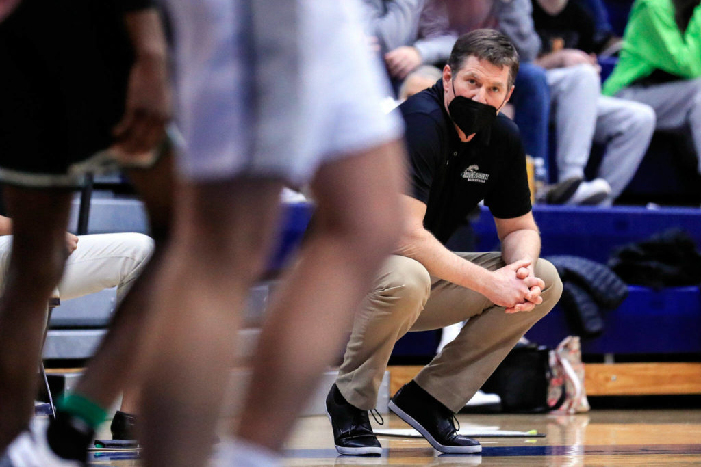 Jackson’s head coach, Steve Johnson, watches the action on the court Friday evening at Glacier Peak High School in Snohomish, Washington on January 21, 2022. The Grizzles won 57-54. (Kevin Clark / The Herald)
