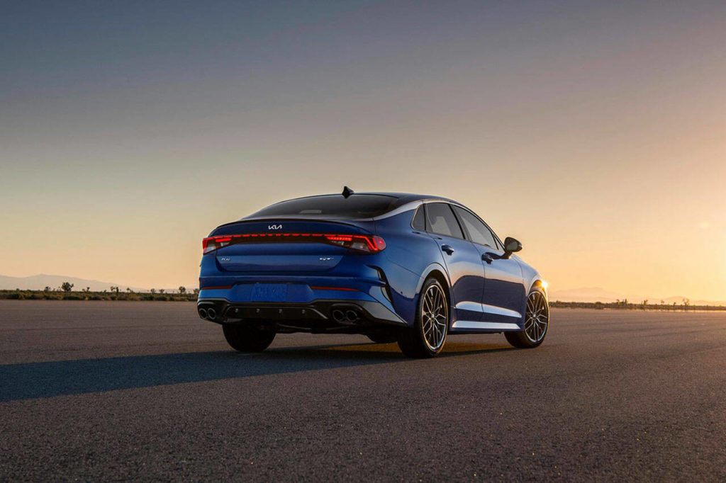 The 2022 Kia K5 is badged with the brand’s trippy new logo. (Manufacturer photo)
