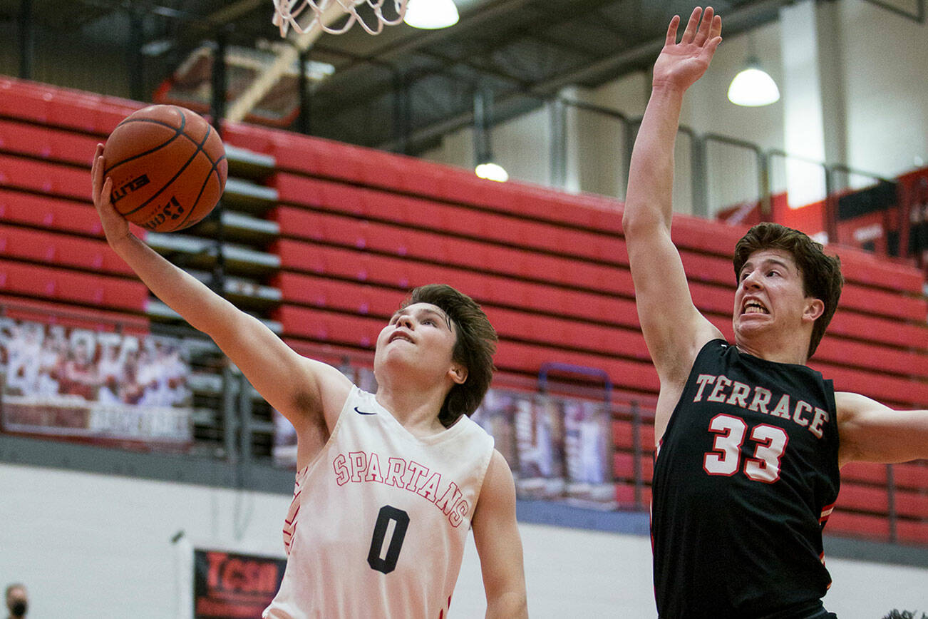 Stanwood's Owen Thayer makes a layup during the game against Mountlake Terrace on Thursday, Jan. 20, 2022 in Stanwood, Washington. (Olivia Vanni / The Herald)