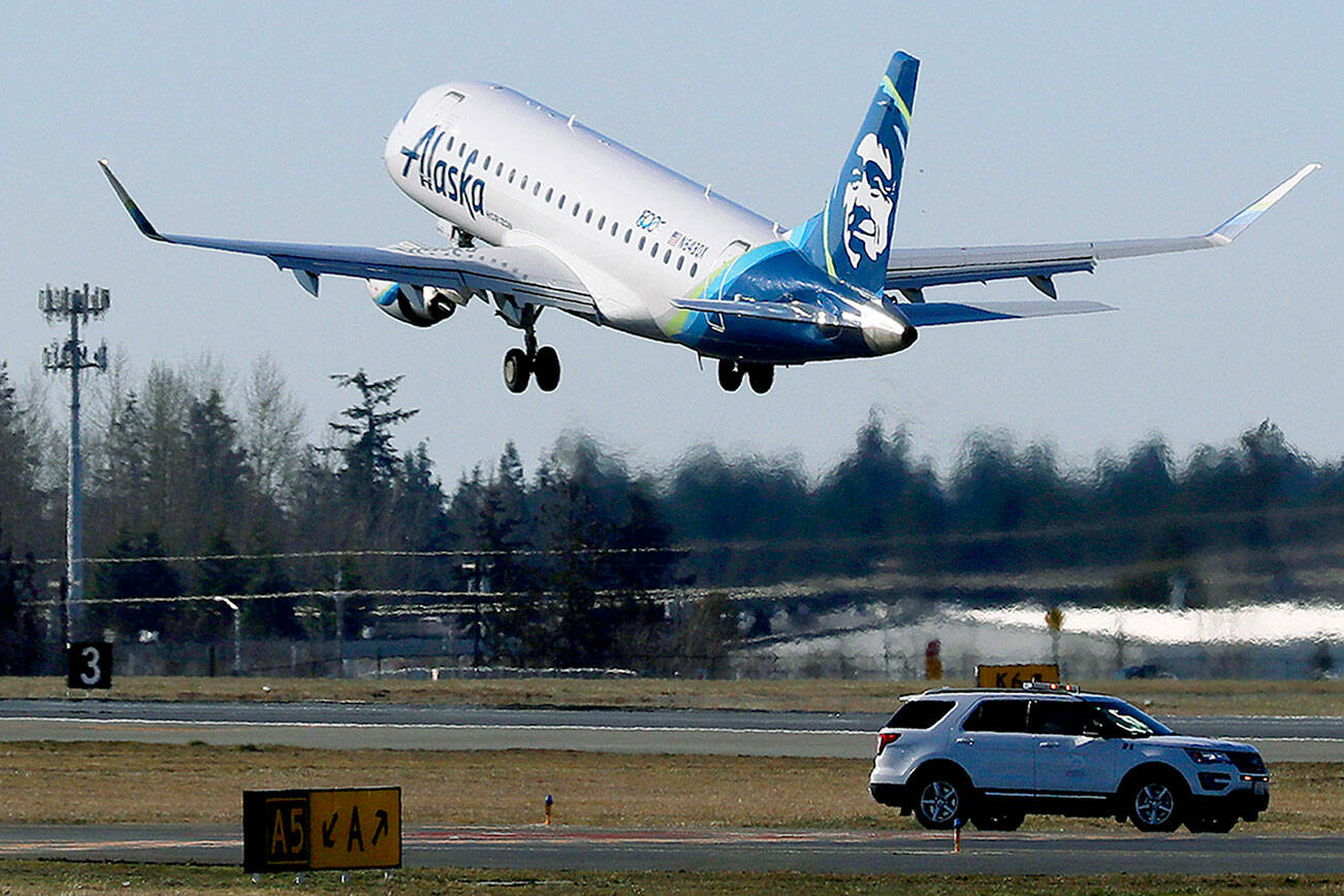 An Alaska Airlines Embraer 175 airplane bound for Portland, Ore., takes off Monday, March 4, 2019, at Paine Field in Everett, Wash. The flight was the first flight on the inaugural day for commercial passenger flights from the airport. Alaska Airlines began scheduled flights Monday, and United Airlines will begin commercial flights on March 31, 2019. (AP Photo/Ted S. Warren)
