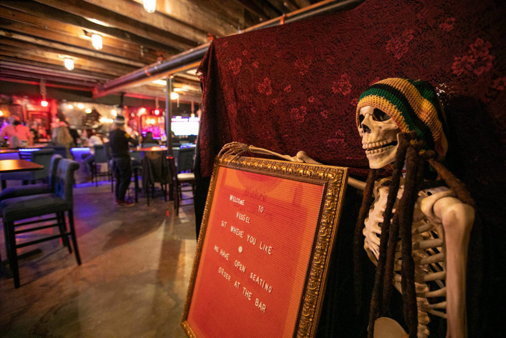 A sign and skeleton welcome guests Thursday at Vessel Taphouse in Lynnwood. (Ryan Berry / The Herald)
