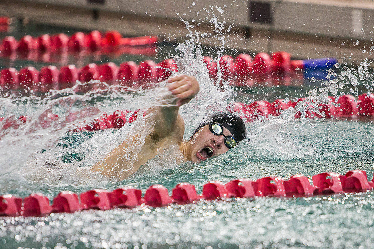 Lake Stevens' DJ Trout takes a final breath before finishing the 100 Yard Freestyle during the swim meet again Glacier Peak and Snohomish on Thursday, Jan. 27, 2022 in Snohomish, Washington. (Olivia Vanni / The Herald)