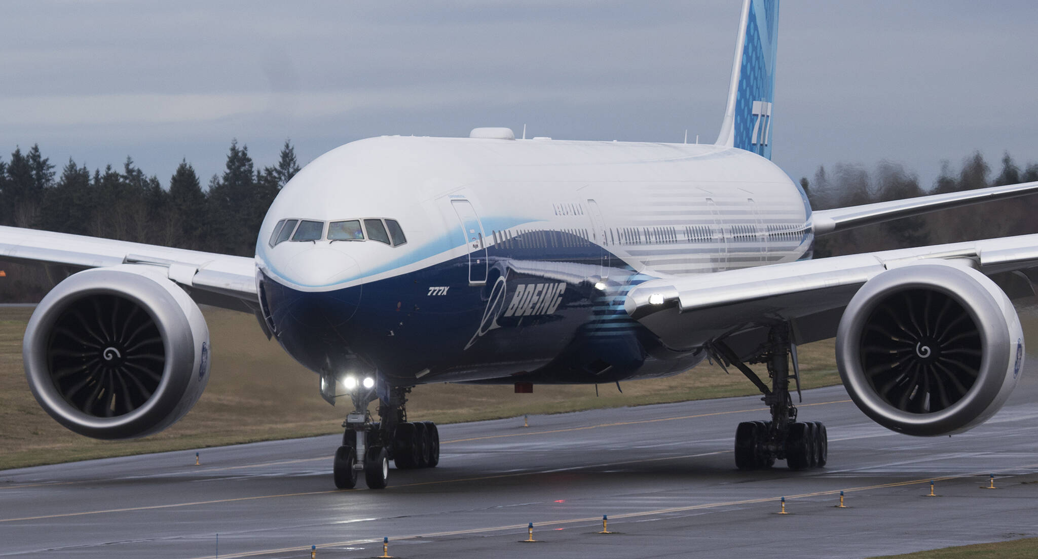 Boeing’s 777X passenger plane taxies down the runway for its first flight from Paine Field in Everett to Boeing Field in Seattle on Jan. 25, 2020. (Andy Bronson / Herald file)