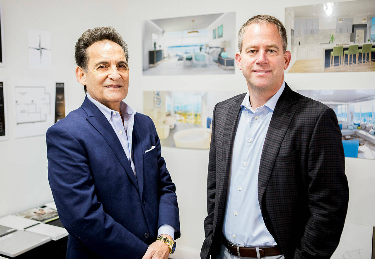 Tim Corpus and Dan Gunderson at their showroom for Colby Tower on Dec. 6, 2021, in Everett. (Olivia Vanni / The Herald)