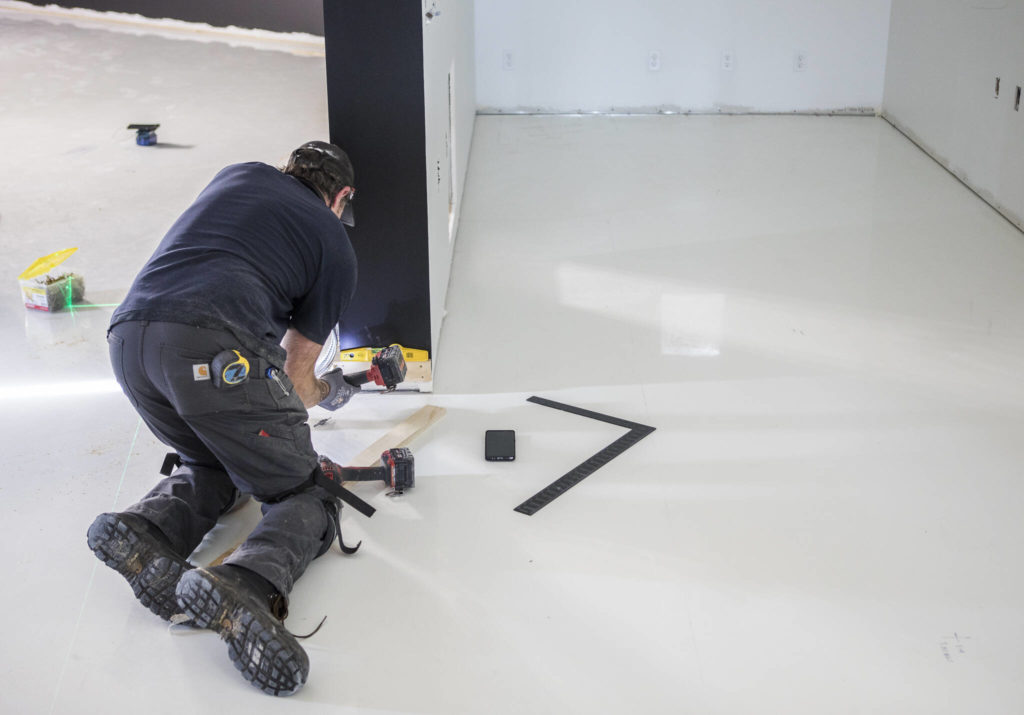 Finishing work is done at the entrance of the new Helion Energy headquarters in Everett. (Olivia Vanni / The Herald)
