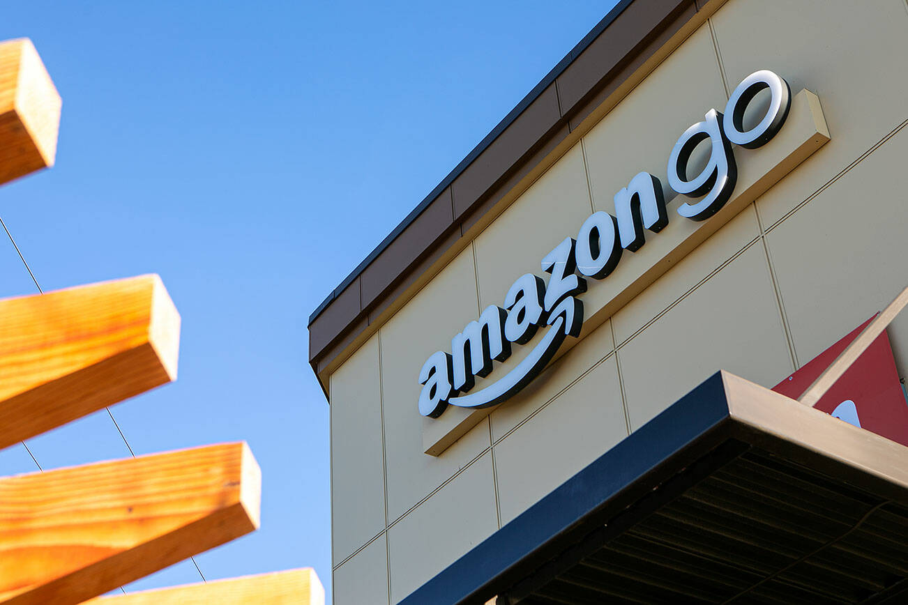 A sign is up on a new Amazon Go building along 132nd St SE Thursday, Jan. 27, 2022, in Mill Creek, Washington. The cashierless grab-and-go store is set to open in the coming months. (Ryan Berry / The Herald)