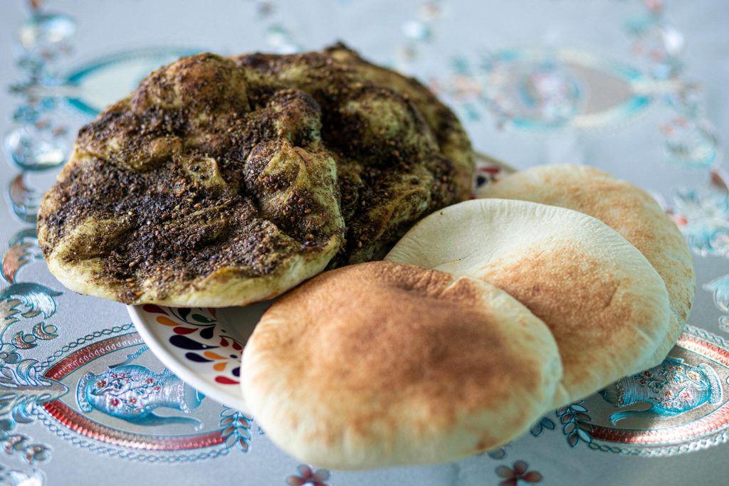 The za’atar bread and pita bread at Alida’s Bakery in south Everett were part of Taylor Goebel’s introduction to the Snohomish County food scene. (Ryan Berry / The Herald)
