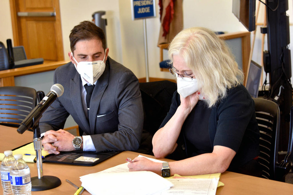 Jared Corson (left) with his defense attorney, Karen Halverson, during his trial Friday at the Snohomish County Courthouse in Everett. (Ellen Dennis / The Herald) 
