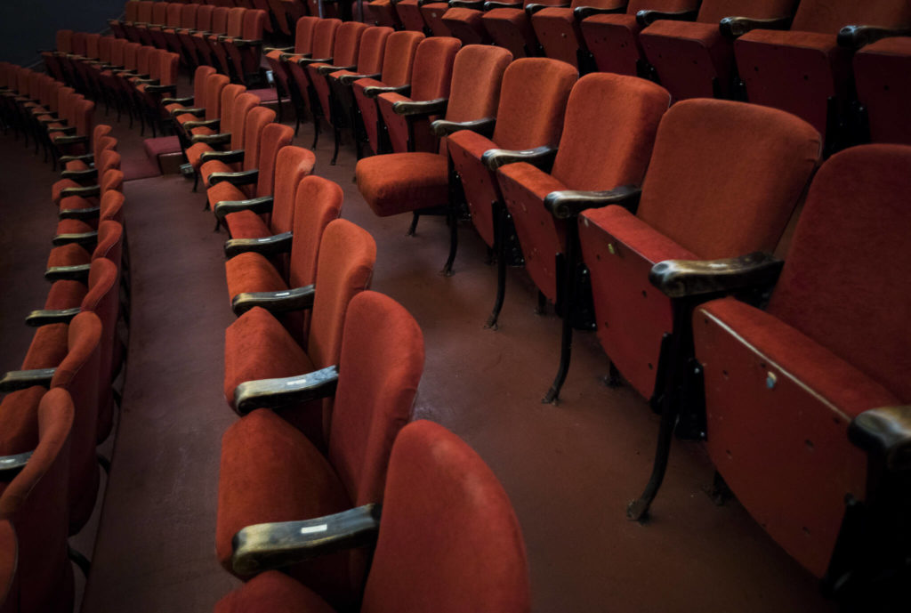One velour covered chair hangs open at the Historic Everett Theatre. (Olivia Vanni / The Herald)
