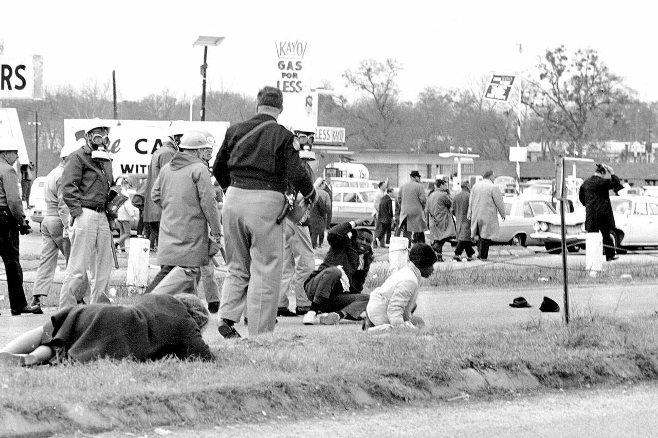 Civil rights demonstrators struggle on the ground as state troopers break up a march in Selma, Ala., on March 7, 1965. The world knows the names of John Lewis and a few more of the voting rights demonstrators who walked across Selma’s Edmund Pettus Bridge in 1965 only to be attacked by Alabama state troopers on a day that came to be called “Bloody Sunday.” (Associated Press file photo)