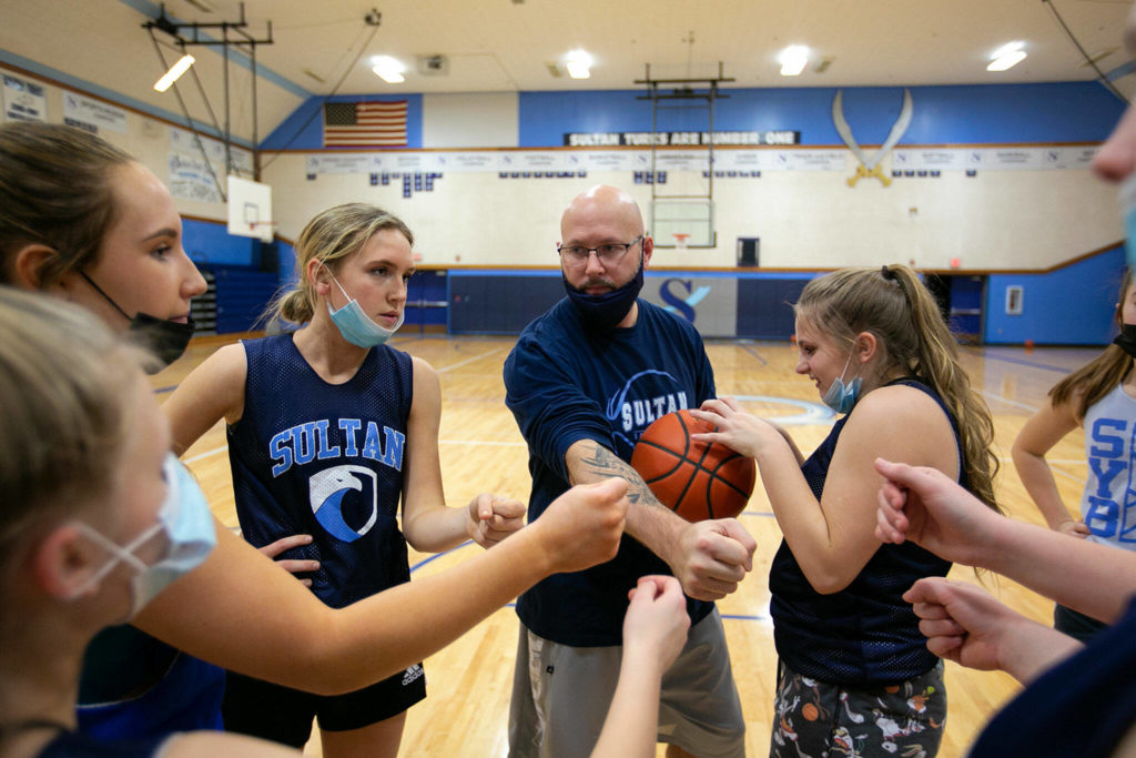 Sultan head coach Todd Weideman talks to his team during practice Thursday at Sultan High School. (Ryan Berry / The Herald)
