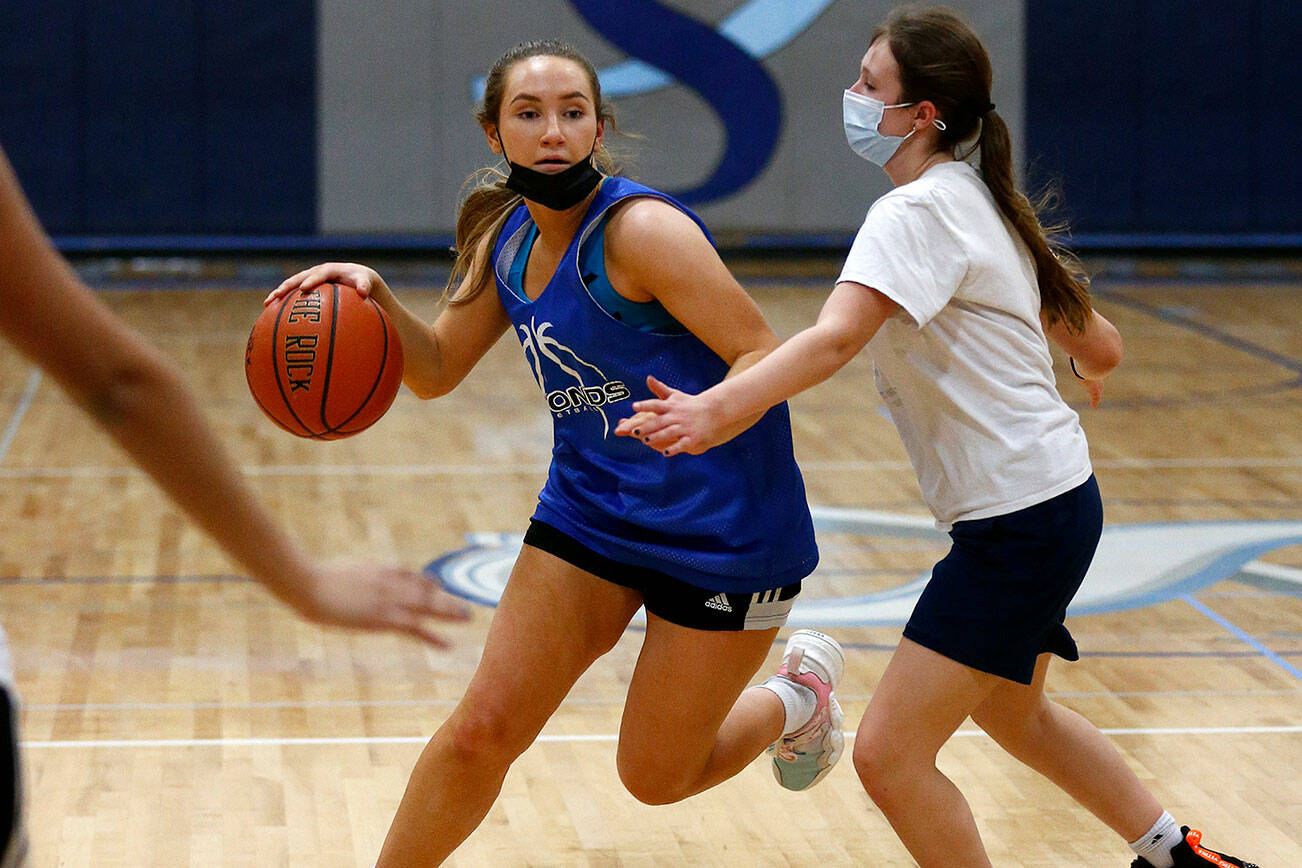 Sultan senior Grace Trichler looks to create space from a defender during practice Thursday, Feb. 3, 2022, at Sultan High School in Sultan, Washington. (Ryan Berry / The Herald)