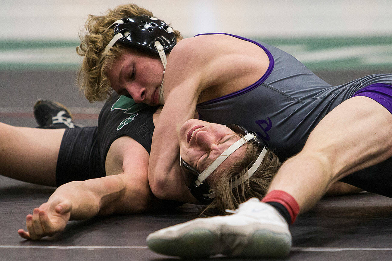 Lake Stevens’ Kael Anderson pins Jackson’s Jonah Justice to win during the 4A sub-regional wrestling meet at Henry M. Jackson High School on Saturday, Feb. 5, 2022 in Everett, Wa. (Olivia Vanni / The Herald)