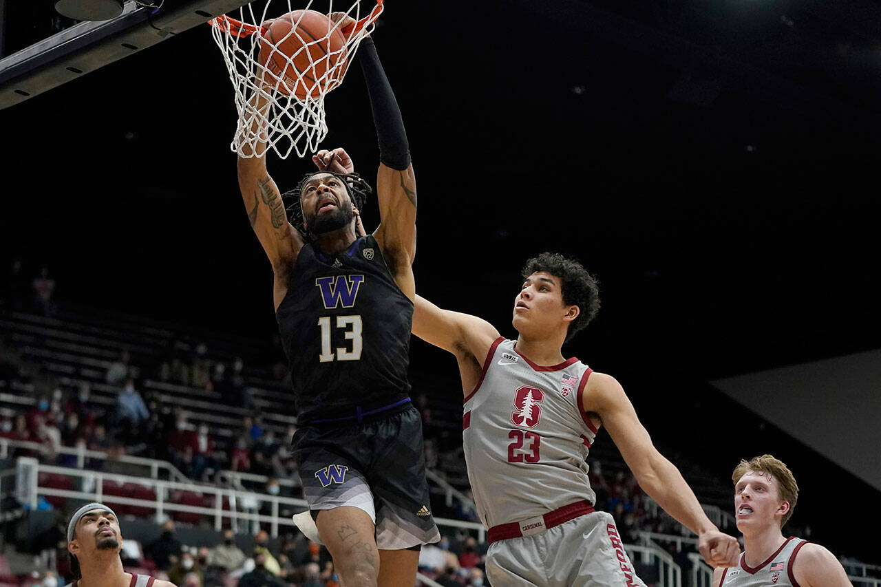 Washington forward Langston Wilson dunks against during a game against Stanford on Sunday in Stanford, Calif. (AP Photo/Jeff Chiu)